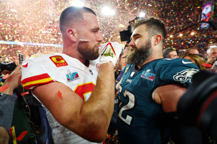 Brothers Travis (left) and Jason Kelce meet after Travis' Cheifs beat Jason's Eagles, 38-35, in Super Bowl LVII